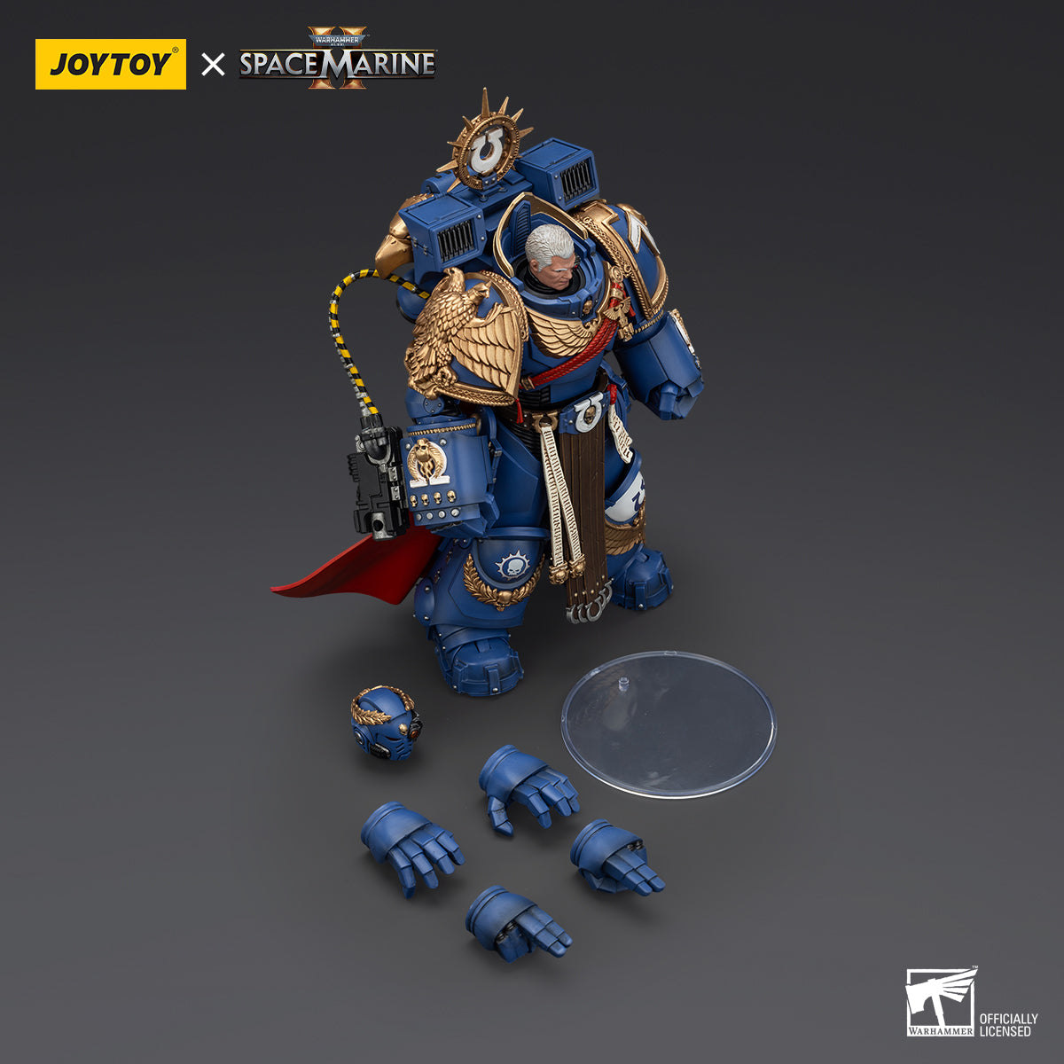 Contents of Ultramarines Marneus Calgar, Chapter Master package, including the action figure, interchangeable hands, and accessories, all neatly packed for display or customization.