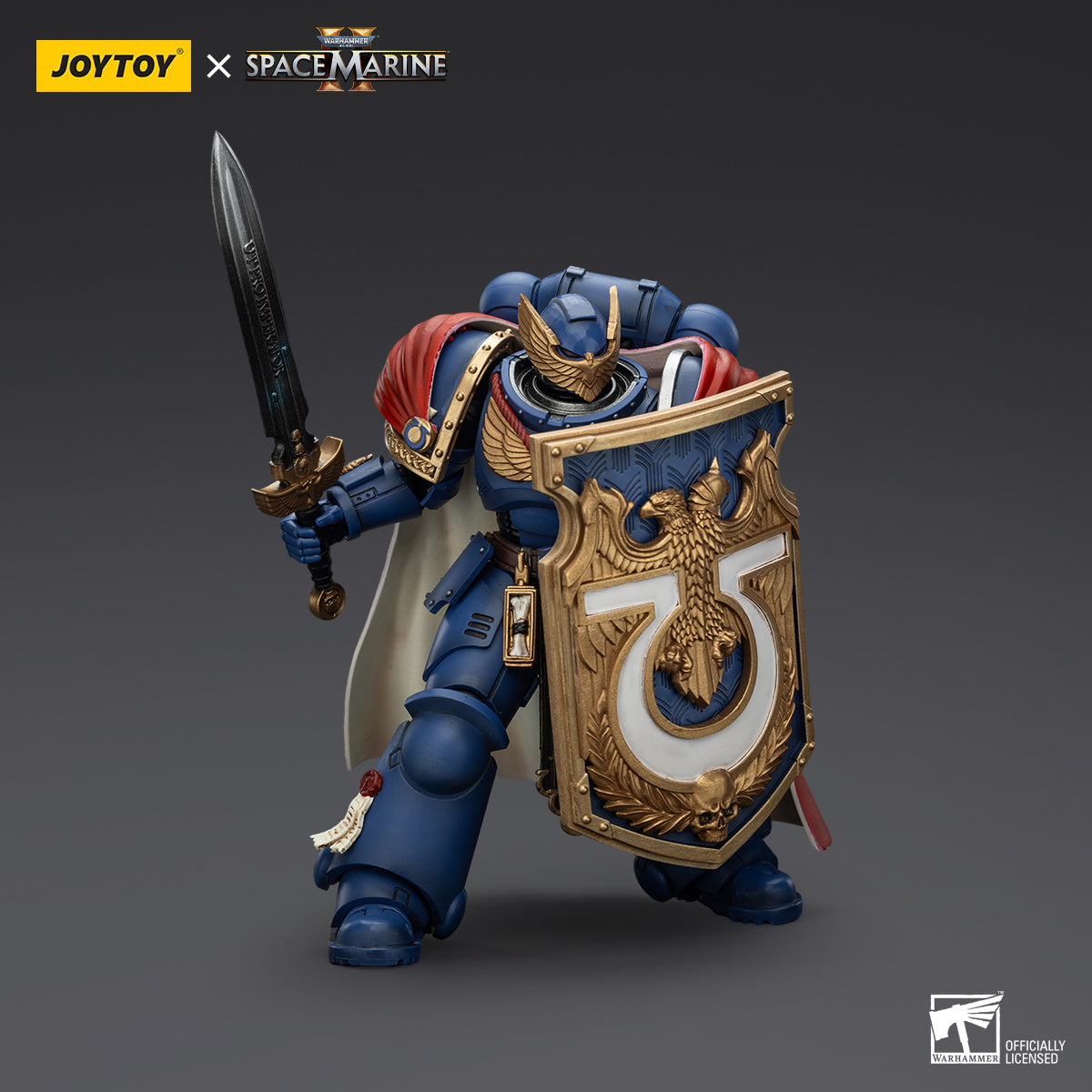 Ultramarines Victrix Honour Guard action figure in battle stance, holding a shield in the left hand and a sword in the right hand, ready for combat, showcasing dynamic action and detailed armor design