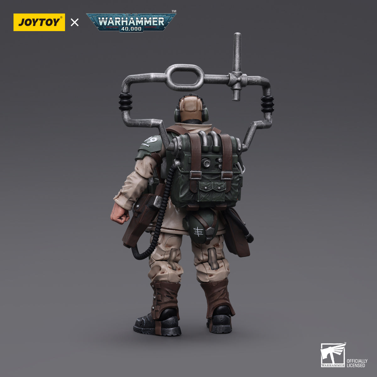 Back view of the Cadian Command Squad Veteran with Master Vox. The vox-caster is prominently featured, with the intricate cables and antennas visible as they connect to the soldier’s communication gear.