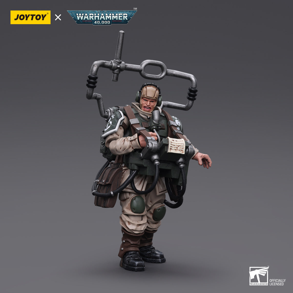 Side view of the Cadian Command Squad Veteran with Master Vox. The veteran’s armored silhouette is framed by the massive vox-caster, which is equipped with antennae and signal relays.